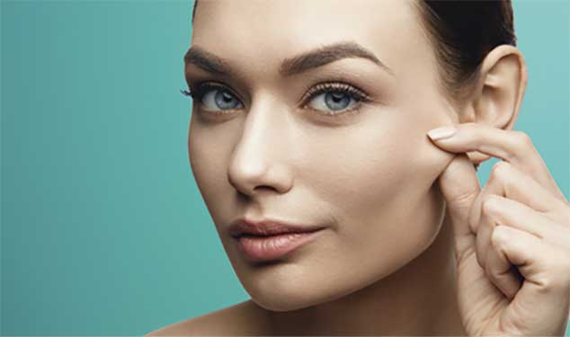 Woman pinching the skin on her cheek for Morpheus8 skin remodelling in Amsterdam